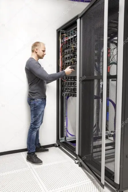 Technician installing network equipment at a business site